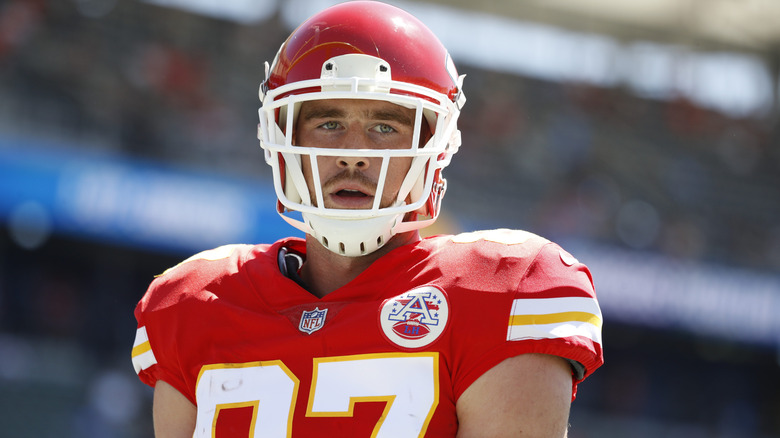 Travis Kelce staring ahead in Kansas City Chiefs helmet and uniform