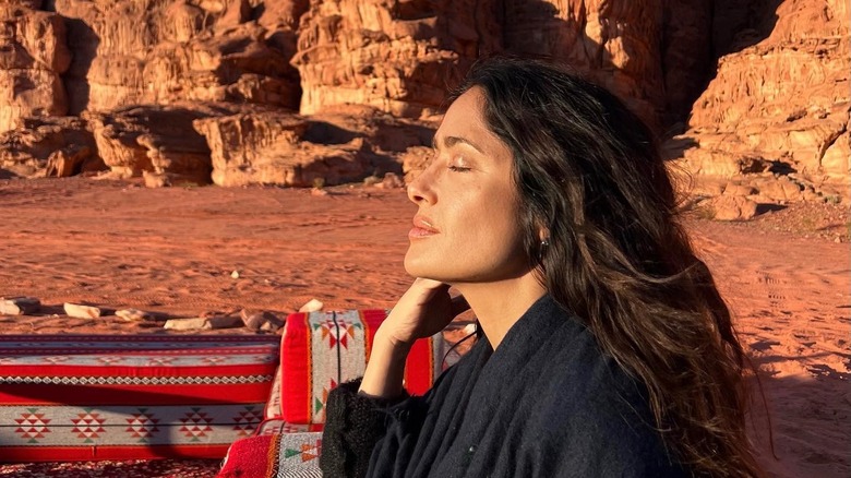 Fresh-faced Salma Hayek with the sun on her face while exploring the mountains 