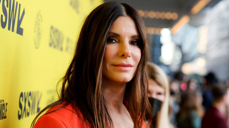 Sandra Bullock turning her head to smile into the camera