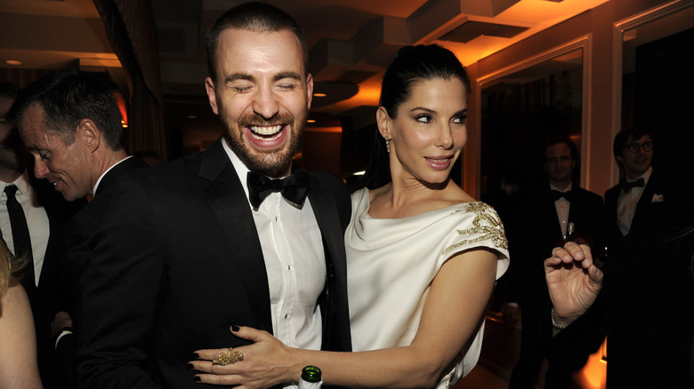 Chris Evans and Sandra Bullock laughing