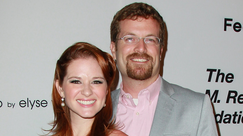 Sarah Drew posing with husband