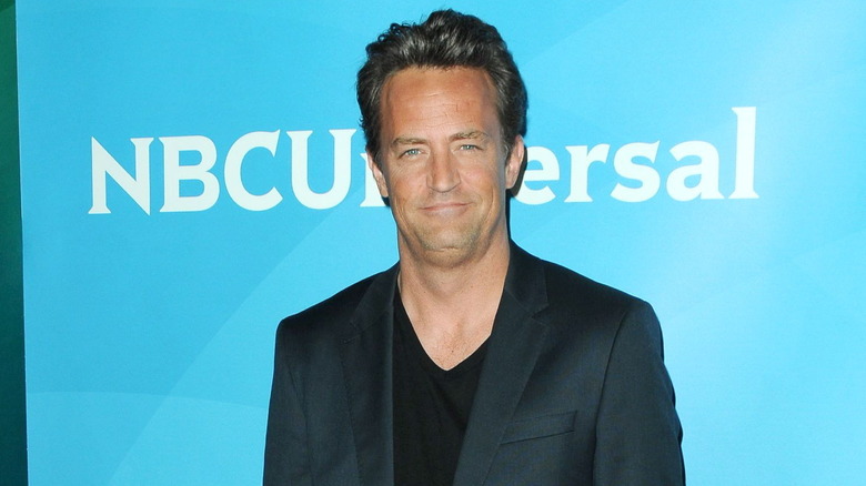 Matthew Perry smirking