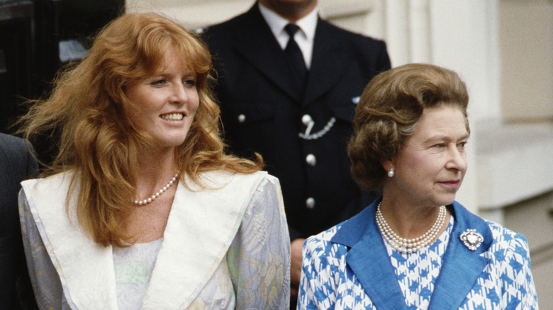 Sarah Ferguson walks beside Queen Elizabeth II