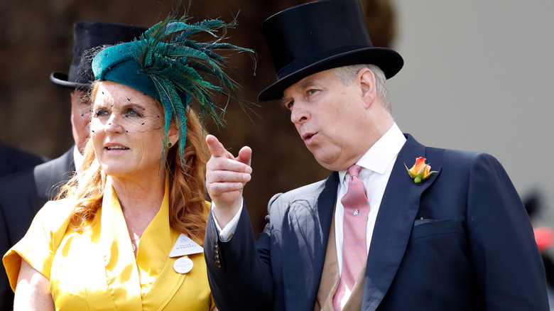 Sarah Ferguson in yellow dress talks to Prince Andrew in top hat and tux