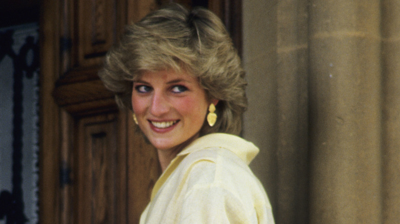 Princess Diana smiles over her shoulder