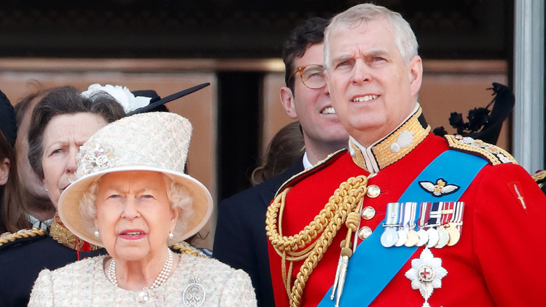 Queen Elizabeth and Prince Andrew looking serious