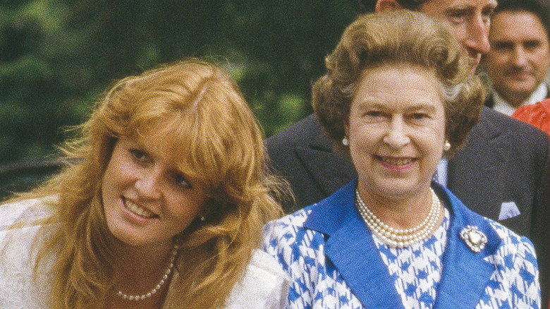 Fergie poses next to the Queen. 