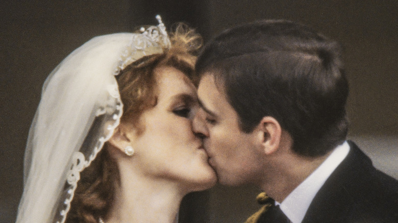 View of just-married couple Sarah, Duchess of York, and Prince Andrew, Duke of York, as they wave from the balcony of Buckingham Palace, London, England, July 23, 1986. 