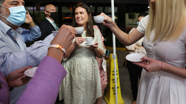 Sarah Huckabee Sanders drinking coffee