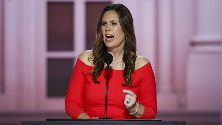 Sarah Huckabee Sanders in a red dress