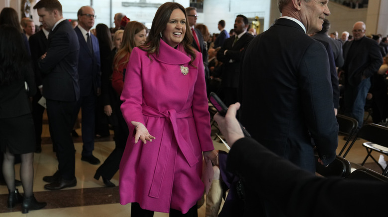 Sarah Huckabee Sanders in pink coat