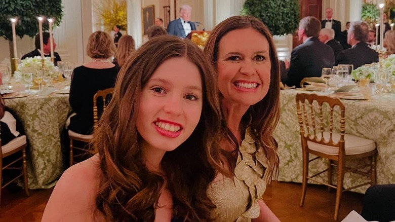 Sarah Huckabee Sanders smiling with daughter Scarlett