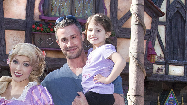 Toddler Charlotte Prinze posing with Freddie Prinze, Jr