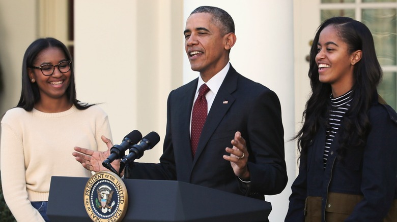 Sasha Obama, Barack Obama, Malia Obama smiling