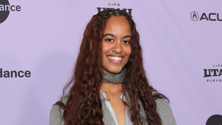 Malia Ann Obama smiling while attending The Heart Premiere