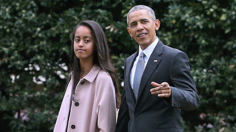 Barack Obama walking and talking to Malia Obama