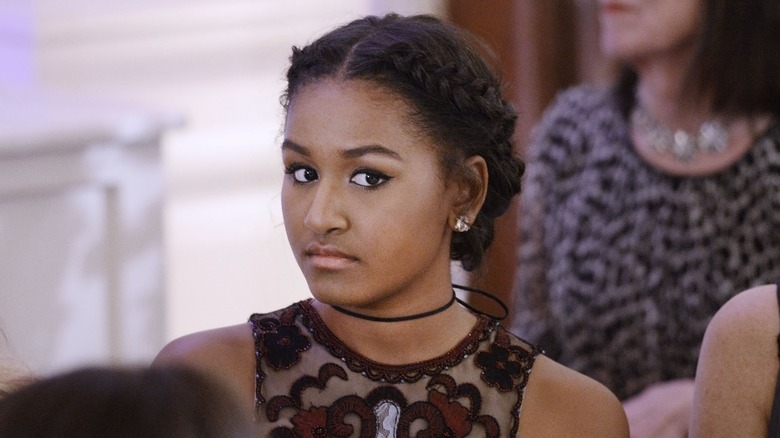 Sasha Obama staring at camera