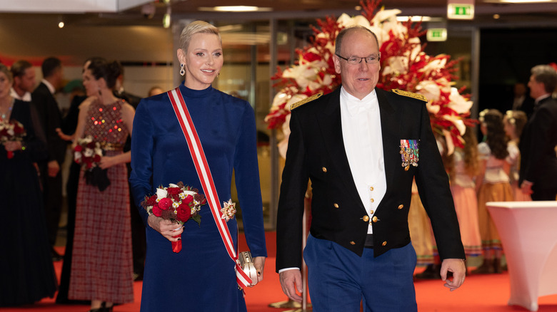 Princess Charlene and Prince Albert walking