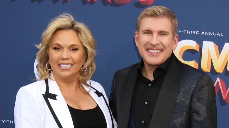 Julie Chrisley Todd Chrisley smiling together on red carpet