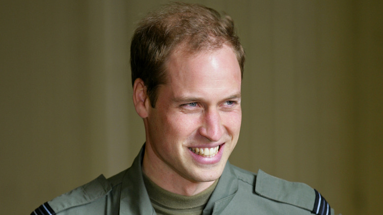 Prince William stands in an aircraft hanger at RAF Valley in Holyhead, United Kingdom (2011)