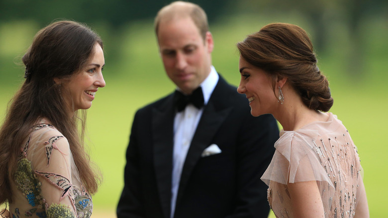 Kate Middleton chatting to Rose Hanbury with Prince William in the background