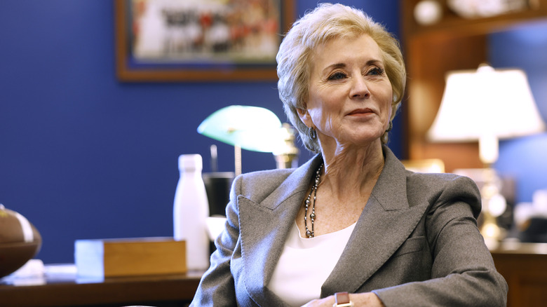 Linda McMahon smiling in an office