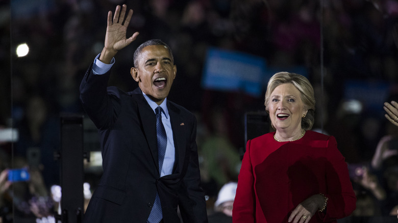 Hillary Clinton and Barack Obama waving