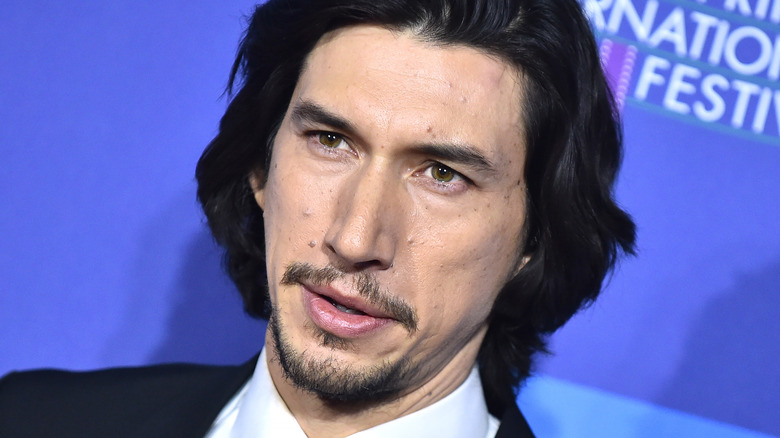 Adam Driver staring