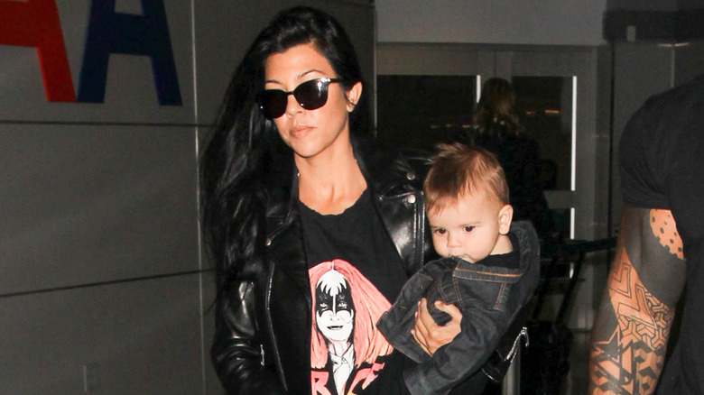 Kourtney Kardashian with a baby Reign Disick