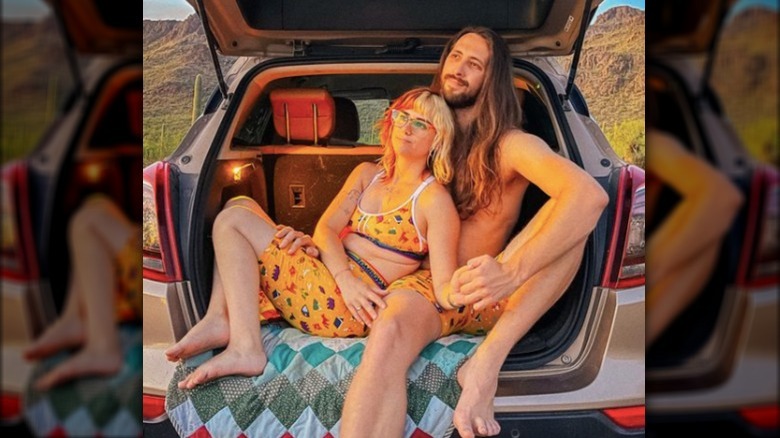 Couple sitting wearing matching boxers