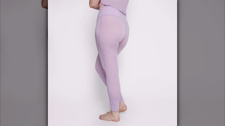 model wearing purple thermal leggings 