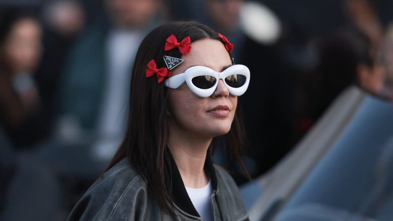 woman with sunglasses and barettes in hair