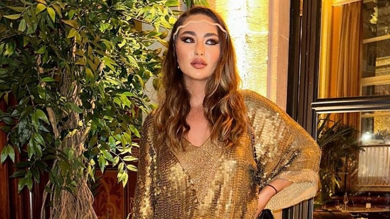 Saskia Connery wearing glittery gold