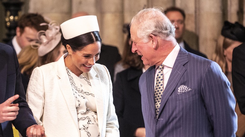 Prince Charles speaking with Meghan Markle