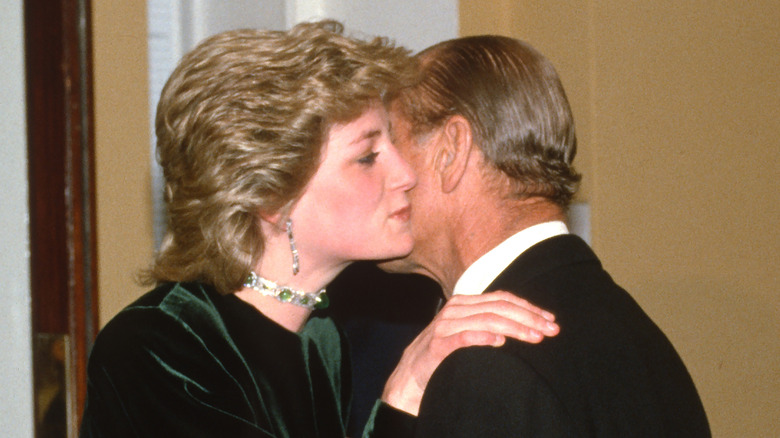 Princess Diana embracing Prince Philip