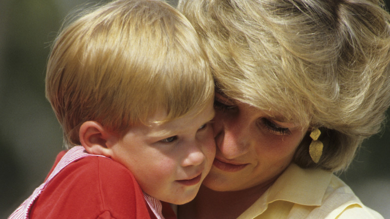 Princess Diana holding Prince Harry