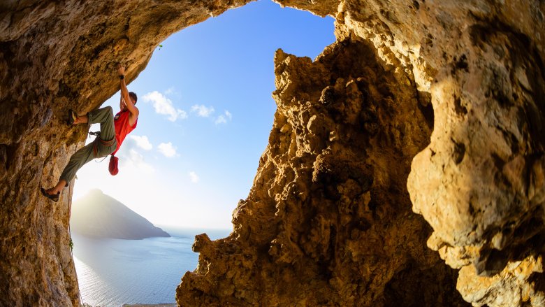 Man climbing cave