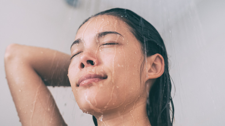 Woman rinsing hair