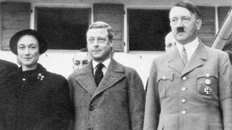 Wallis Simpson, Edward VIII, & Adolf Hitler standing together