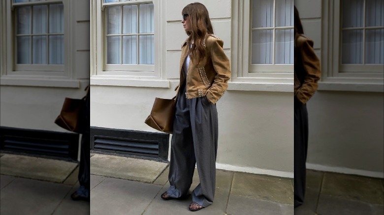 woman wearing jacket, trousers, mesh flats