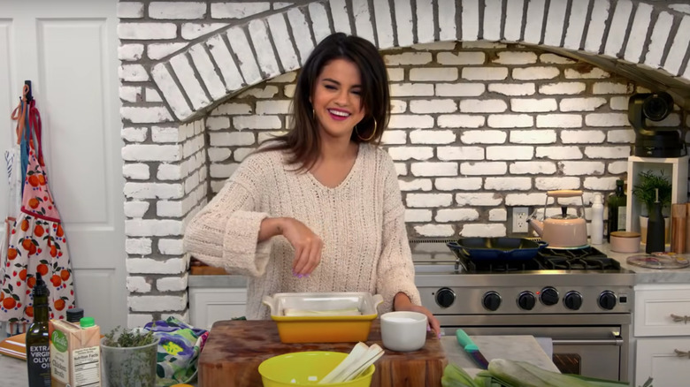 Selena Gomez in kitchen cooking