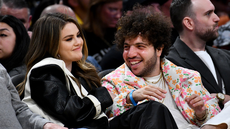 Benny Blanco smiling at Selena Gomez