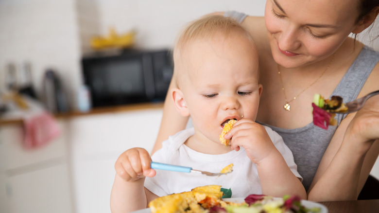 mother feeding baby