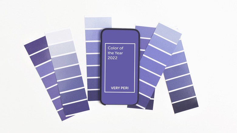 paint swatches and phone with pantone's 2022 color of the year