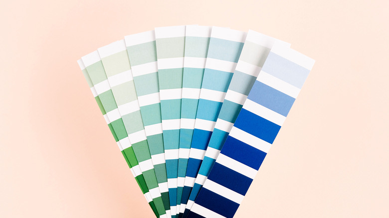 swatches of blue and green paint fanned out