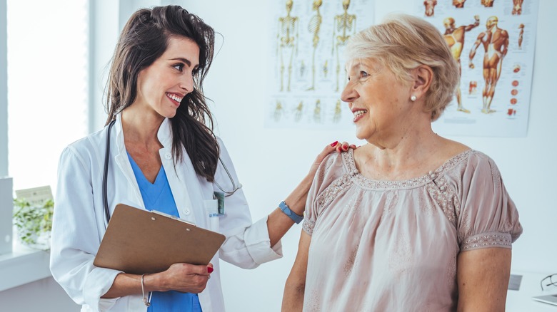 senior woman talking to young female doctor