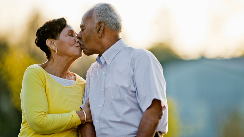 Black senior couple kissing