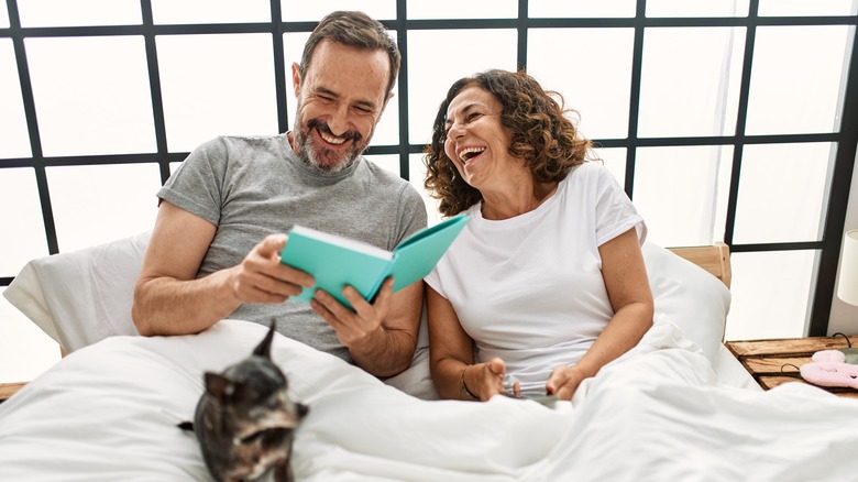 middle age Hispanic couple in bed