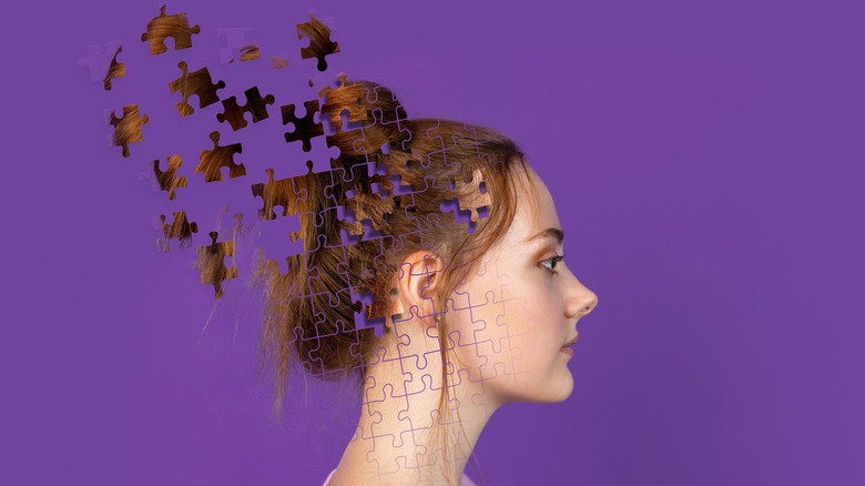 girl with puzzle pieces for head