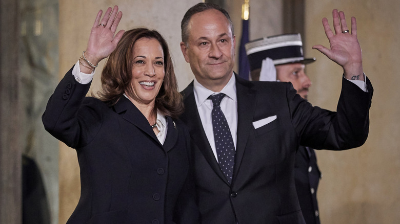 Doug Emhoff and Kamala Harris waving